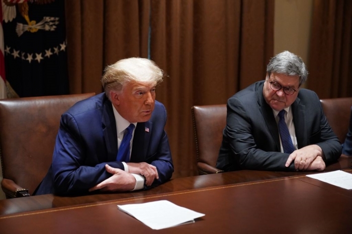 President Donald Trump, with Attorney General William Barr at his side, speaks in the White House Cabinet Room on September 23, 2020. (Photo by MANDEL NGAN/AFP via Getty Images)