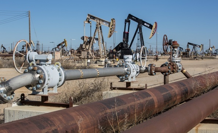 Oil pipelines, pumping rigs, and electrical transmission lines dot the landscape along California's "Petroleum Highway" (Highway 33) running along the northwestern side of the San Joaquin Valley on April 24, 2020, near McKittrick, California. (Photo by George Rose/Getty Images)