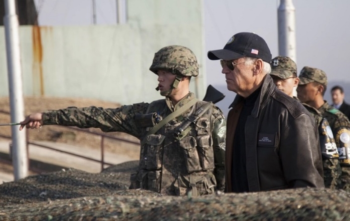 Then-Vice President Biden looks into North Korea during a visit to the DMZ separating the two Koreas in December 2013. (Photo: U.S. Navy / Mass Communication Specialist 2nd Class Chris Church)