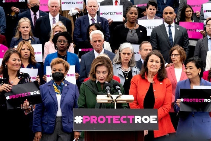 Speaker of the House Nancy Pelosi, joined by House Democrats, her fellow abortion advocates, protest the leaked Supreme Court draft decision on Roe v. Wade at the US Capitol on May 13, 2022. (Photo by STEFANI REYNOLDS/AFP via Getty Images)