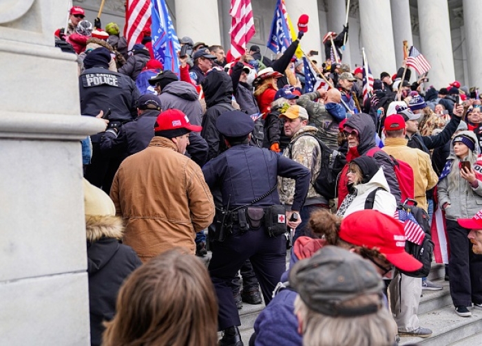 A crowd gathers outside the U.S. Capitol on January 06, 2021 in Washington, D.C. (Photo by Robert Nickelsberg/Getty Images)