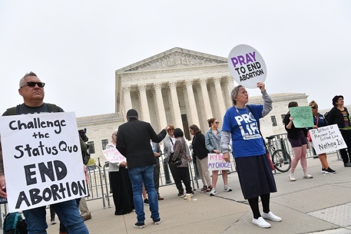 Demonstrators gather outside the US Supreme Court on May 4, 2022. (Photo by NICHOLAS KAMM/AFP via Getty Images)