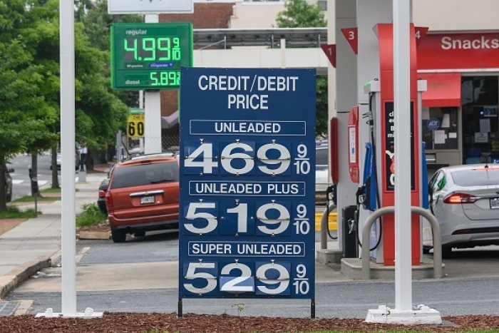 Gasoline prices are posted at a gas station in Washington, DC, on May 26, 2022. They're even higher now. (Photo by NICHOLAS KAMM/AFP via Getty Images)