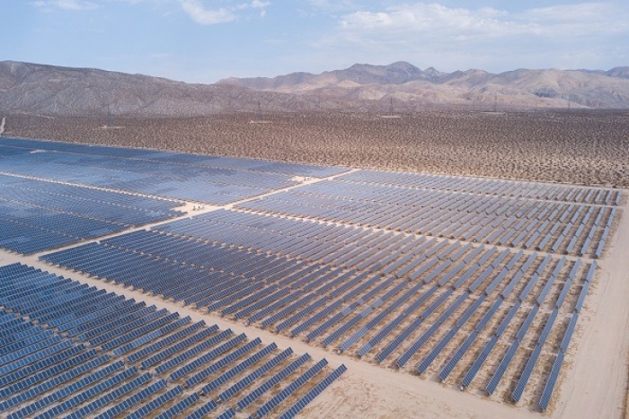 An aerial image of solar panels at an electricity generation plant in Kern County near Mojave, California. (Photo by PATRICK T. FALLON/AFP via Getty Images)
