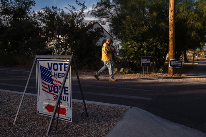 A man leaves a polling station in Benson, Arizona, on November 3, 2020. (Photo by ARIANA DREHSLER/AFP via Getty Images)