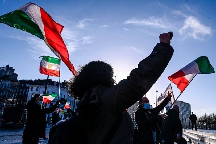 Iranian dissidents protest outside the courthouse in Antwerp, Belgium, in Februry 2021, on the day the court sentenced Iranian diplomat Assadollah Assadi to 20 years’ imprisonment. (Photo by Dirk Waem/ Belga /AFP via Getty Images)