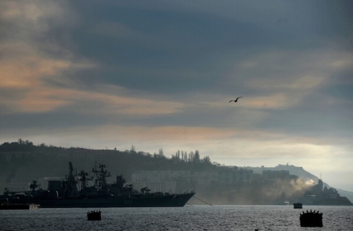 A Russian Navy frigate docked off the port of Sevastopol in Russian-occupied Crimea. (Photo by Filippo Monteforte / AFP via Getty Images)