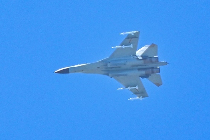 A Chinese fighter jet flies off the Chinese mainland near the Taiwan Strait on Friday. (Photo by Hector Retamal / AFP via Getty Images)