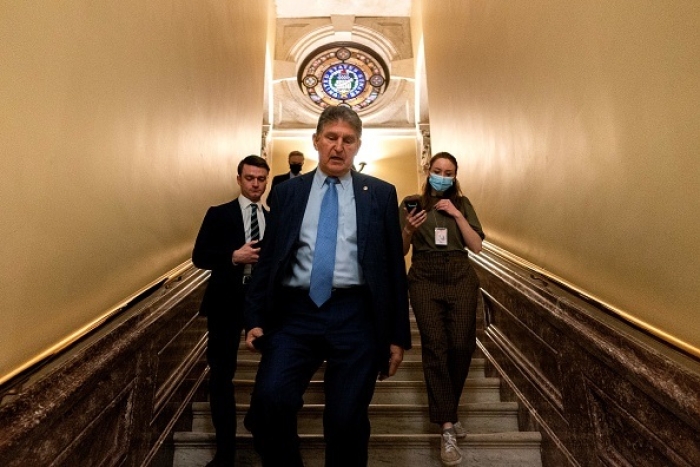 Senator Joe Manchin, Democrat of West Virginia, departs the US Capitol in Washington, DC, on March 1, 2022. (Photo by STEFANI REYNOLDS/AFP via Getty Images)