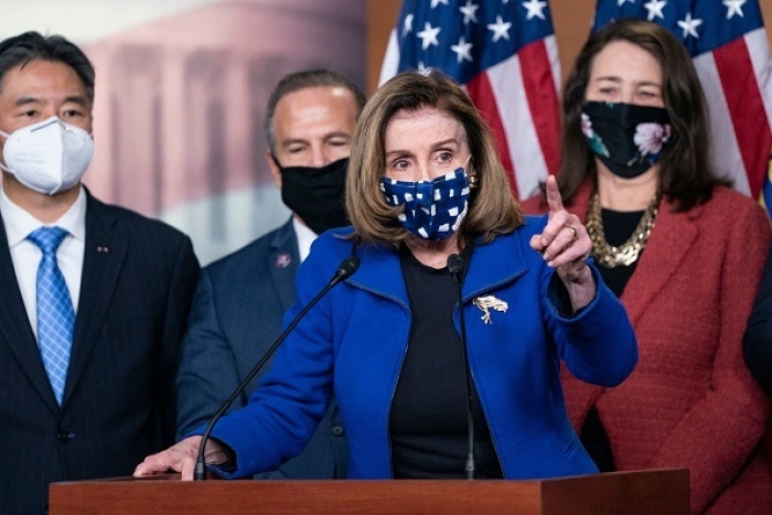 House Speaker Nancy Pelosi, joined by House impeachment managers, speaks to the press after the Senate voted to acquit former President Donald Trump at his second impeachment trial on February 13, 2021. (Photo by ALEX EDELMAN/AFP via Getty Images)