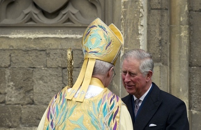 The then-Prince of Wales, now King Charles III, speaks to the Archbishop of Canterbury Justin Welby, head of the Church of England, in 2013. The British monarch carries the titles 'Defender of the Faith’ and ‘Supreme Governor of the Church of England.’ (Photo by Adrian Dennis / AFP via Getty Images) The then-Prince of Wales, now King Charles III, speaks to the Archbishop of Canterbury Justin Welby, head of the Church of England, in 2013. The British monarch carries the titles 'Defender of the Faith’ and ‘Supreme Governor of the Church of England.’ (Photo by Adrian Dennis / AFP via Getty Images)