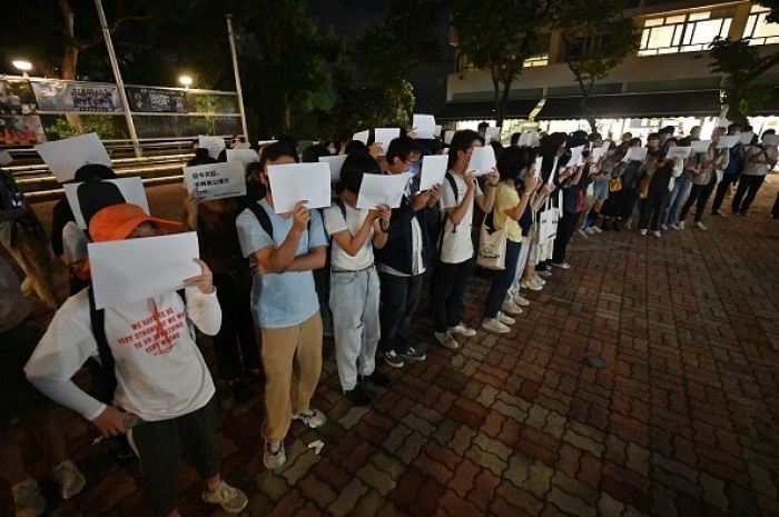 Students in Hong Kong take part in a protest on Monday in solidarity with those held in mainland China against the government’s ‘zero COVID’ policies. (Photo by Peter Parks / AFP via Getty Images) Students in Hong Kong take part in a protest on Monday in solidarity with those held in mainland China against the government’s ‘zero COVID’ policies. (Photo by Peter Parks / AFP via Getty Images)