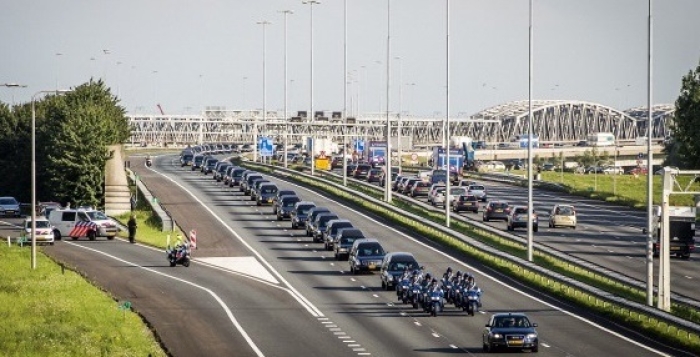 A convoy of hearses carrying the remains of victims of Malaysia Airlines flight MH-17 heads for a military base in the Netherlands for identification on July 23, 2014, six days after the plane was shot down over eastern Ukraine. All 298 passengers and crew were killed. (Photo by Remko de Waal / AFP via Getty Images) A convoy of hearses carrying the remains of victims of Malaysia Airlines flight MH-17 heads for a military base in the Netherlands for identification on July 23, 2014, six days after the plane was shot down over eastern Ukraine. All 298 passengers and crew were killed. (Photo by Remko de Waal / AFP via Getty Images)