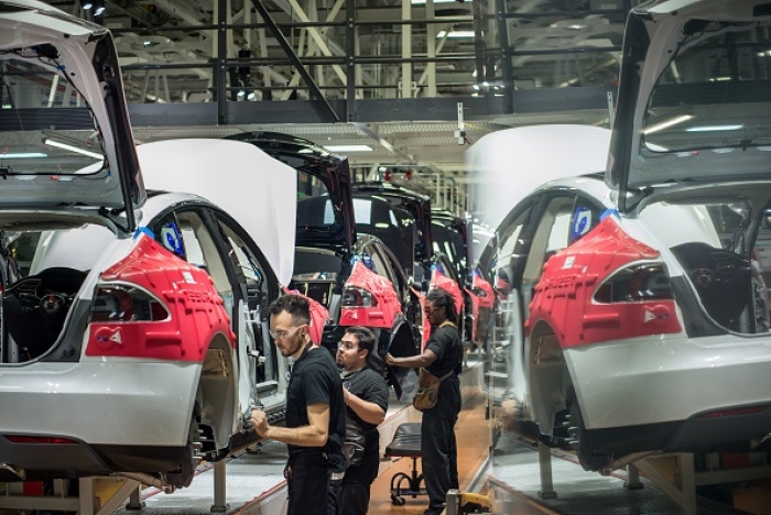 Workers assemble cars at Tesla’s factory in Fremont, California. (Photo by David Butow / Corbis via Getty Images) Workers assemble cars at Tesla’s factory in Fremont, California. (Photo by David Butow / Corbis via Getty Images)
