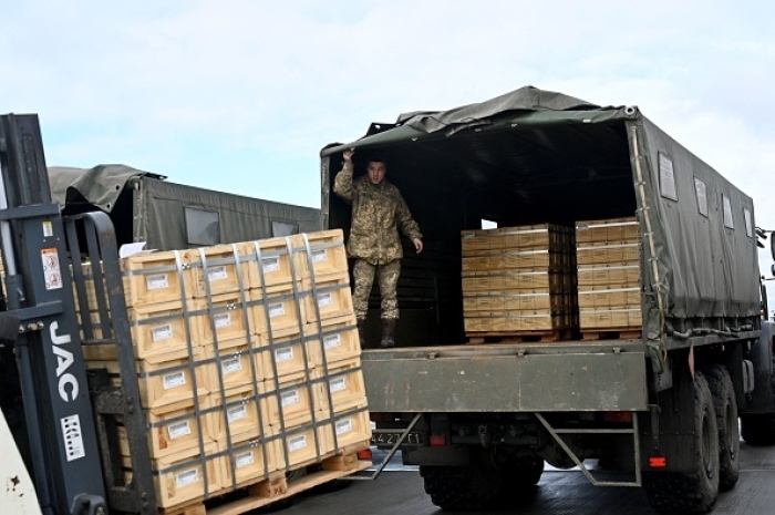 Ukrainian soldiers unload U.S.-supplied military aid in Kyiv last February. (Photo by Sergei Supinsky / AFP via Getty Images) Ukrainian soldiers unload U.S.-supplied military aid in Kyiv last February. (Photo by Sergei Supinsky / AFP via Getty Images)