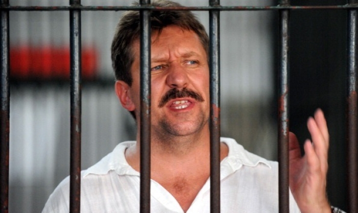 Russian arms dealer Viktor Bout behind bars in Bangkok, Thailand in April 2008. (Photo by Saeed Khan/AFP via Getty Images) Russian arms dealer Viktor Bout behind bars in Bangkok, Thailand in April 2008. (Photo by Saeed Khan/AFP via Getty Images)