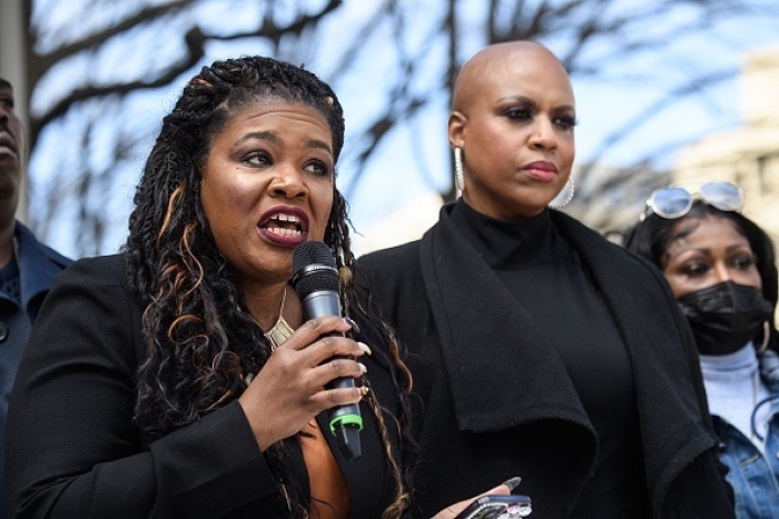 Reps. Cori Bush and Ayanna Pressley attend a rally against "qualified immunity" for law enforcement officers at the Justice Departmentn on March  3, 2022. (Photo by NICHOLAS KAMM/AFP via Getty Images)