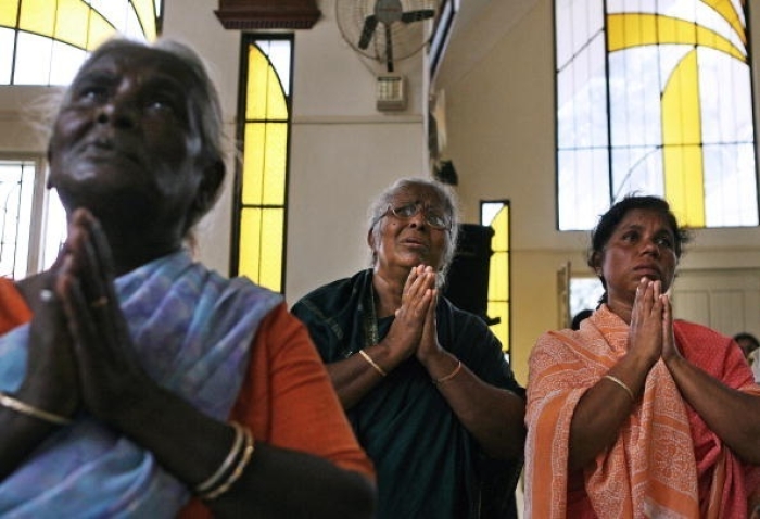 Indian Christians at prayer in a Catholic Church in Bangalore. (Photo by Dibyangshu Sarkar / AFP via Getty Images) Indian Christians at prayer in a Catholic Church in Bangalore. (Photo by Dibyangshu Sarkar / AFP via Getty Images)