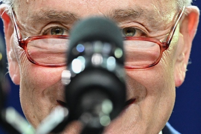 Senate Majority Leader Chuck Schumer (D-N.Y.) is partially obscured by a microphone in this photo by MANDEL NGAN/AFP via Getty Images. Senate Majority Leader Chuck Schumer (D-N.Y.) is partially obscured by a microphone in this photo by MANDEL NGAN/AFP via Getty Images.