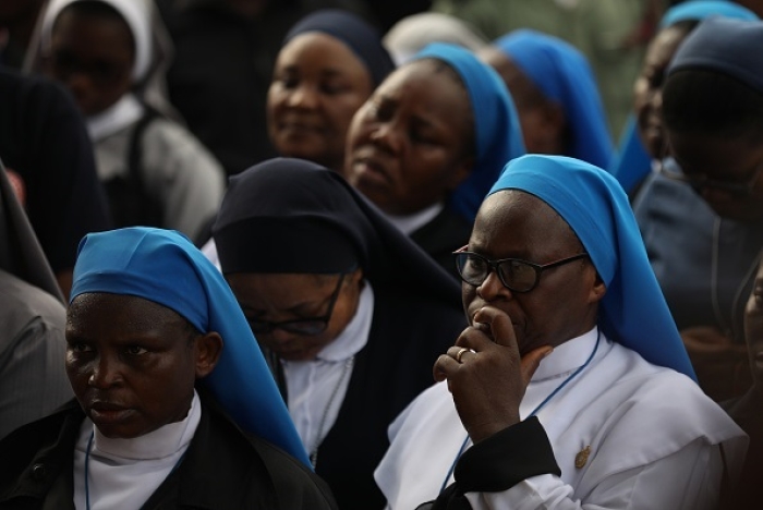 Catholic nuns in Nigeria attend a prayer vigil for peace in Abuja. (Photo by Kola Sulaimon / AFP via Getty Images)