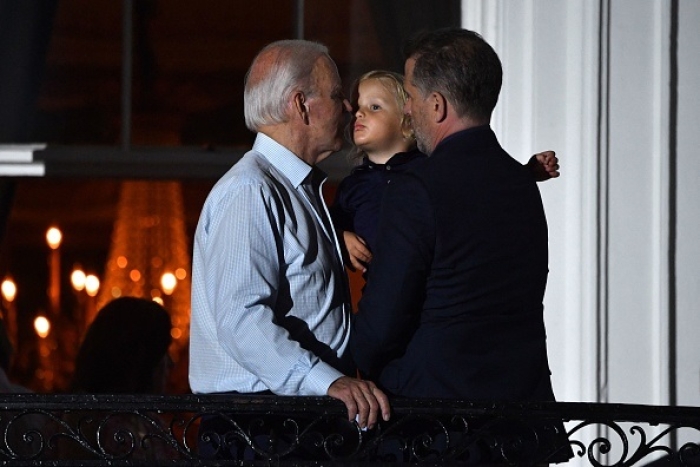 President Joe Biden with his grandson Beau Biden and son Hunter Biden at the White House on July 4, 2022. (Photo by NICHOLAS KAMM/AFP via Getty Images)