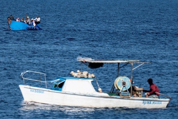 A boat full of Cubans is seen drifting off the coast of Havana on December 12, 2022. (Photo by YAMIL LAGE/AFP via Getty Images)