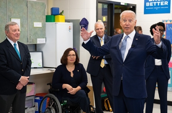 President Joe Biden tours a childhood development center alongside Illinois Democrat Senators Dick Durbin and Tammy Duckworth on July 7, 2021. (Photo by SAUL LOEB/AFP via Getty Images) President Joe Biden tours a childhood development center alongside Illinois Democrat Senators Dick Durbin and Tammy Duckworth on July 7, 2021. (Photo by SAUL LOEB/AFP via Getty Images)