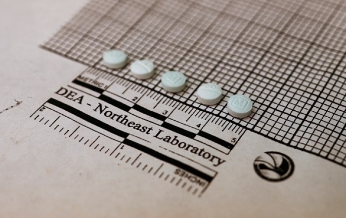 Suspected fentanyl tablets are measured and assessed at a Drug Enforcement Administration laboratory in New York. (Photo by Don Emmert / AFP via Getty Images)