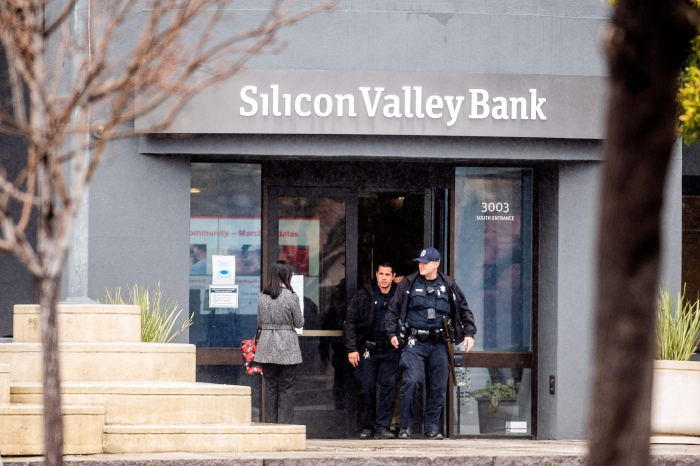 Police officers leave Silicon Valley Banks headquarters in Santa Clara, California on March 10, 2023. - US authorities swooped in and seized the assets of SVB, a key lender to US startups since the 1980s, after a run on deposits made it no longer tenable for the medium-sized bank to stay afloat on its own. (Getty Images)  