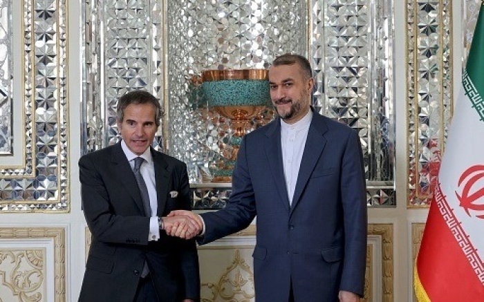 International Atomic Energy Agency Director-General Rafael Grossi shakes hands with Iranian Foreign Minister Hossein Amirabdollahian in Tehran on Saturday. (Photo by Atta Kenare / AFP via Getty Images) International Atomic Energy Agency Director-General Rafael Grossi shakes hands with Iranian Foreign Minister Hossein Amirabdollahian in Tehran on Saturday. (Photo by Atta Kenare / AFP via Getty Images)