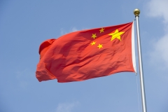 The Chinese flag flaps in the wind. (Photo credit: Lucas Schifres/Getty Images)