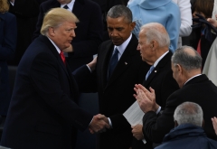 U.S. President Donald Trump shakes hands with former Vice President Joe Biden after being sworn in as president on January 20, 2017 at the U.S. Capitol in Washington, D.C. (Photo credit: MARK RALSTON/AFP via Getty Images)