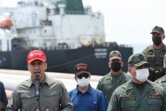 Maduro regime officials, including Industry Minister Tareck El Aissami, left, and Defense Minister Vladimir Padrino, welcome the first Iranian tanker at the El Palito refinery on Monday. (Photo by AFP via Getty Images)