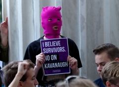 Demonstrators take the steps of the U.S. Supreme Court to protest against the appointment of Supreme Court nominee Brett Kavanaugh. (Photo credit: JOSE LUIS MAGANA/AFP via Getty Images)