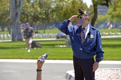 A veteran salutes for a camera at Los Angeles National Cemetery on Memorial Day during the COVID-19 outbreak on May 25, 2020 in Los Angeles, Calif. (Photo credit: Michael Tullberg/Getty Images)