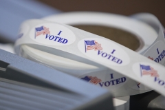 Stickers sit on a table during a presidential primary election at the Journey Church in Kenosha, Wisc., on April 7, 2020. (Photo credit: AMIL KRZACZYNSKI/AFP via Getty Images)