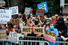 Black Lives Matter and Antifa agitators are held back by a police barrier during a pro-police/Trump rally, organized by "Super Happy Fun America", outside the State House in Boston, Massachusetts on June 27, 2020. (Photo by JOSEPH PREZIOSO/AFP via Getty Images)