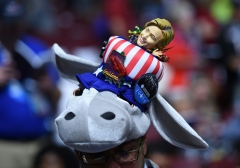 Featured is a hat displaying the Democratic donkey and Hillary Clinton. (Photo credit: TIMOTHY A. CLARY/AFP via Getty Images)