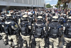 Police in riot gear stop an anti-GOP march from approaching the Tampa Bay Times Forum during a protest rally in Tampa, Florida on August 28, 2012. (Photo by MLADEN ANTONOV/AFP/GettyImages)