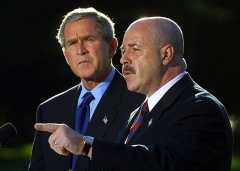 WASHINGTON, UNITED STATES: (FILES) This 03 October, 2003, file photo shows former New York City Police Commissioner Bernard Kerik (R), with US President George W. Bush (L), addressing the media on the South Lawn of the White House in Washington, DC. (Photo by MANNY CENETA/AFP via Getty Images)