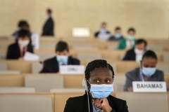 Masked and practicing COVID-19 social distancing, U.N. Human Rights Council delegates consider a resolution Friday after an urgent debate over racism in law enforcement. (Photo by Fabrice Coffrini/POOL/AFP via Getty Images)