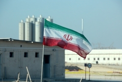 An Iranian flag flies at the country’s Bushehr nuclear power plant. (Photo by Atta Kenare/AFP via Getty Images)