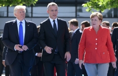 President Trump and German Chancellor Angela Merkel with NATO secretary-general Jens Stoltenberg at a summit in Brussels in 2017. (Photo by Emmanuel Dunand/AFP via Getty Images)