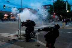 Demonstrators throw rocks at police officers during a protest in Denver, Colorado on May 31, 2020. (Photo by JASON CONNOLLY/AFP via Getty Images)