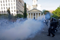 Police officers push back demonstrators, shooting tear gas next to St. John's Episcopal Church across from the White House on June 1, 2020. (Photo by JOSE LUIS MAGANA/AFP via Getty Images)