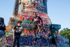 People visit the graffiti-covered statue of Confederate General Robert E. Lee on June 14, 2020 at Monument Avenue in Richmond, Virginia. (Photo by Andrew Lichtenstein/Corbis via Getty Images)