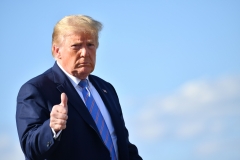 President Donald Trump gives a thumbs-up. (Photo credit: NICHOLAS KAMM/AFP via Getty Images)