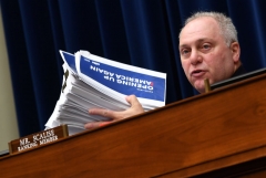 Representative Steve Scalise (R-LA) holds up a stack of safety regulation documents during a House Subcommittee on the Coronavirus Crisis hearing on a national plan to contain the COVID-19 pandemic, on Capitol Hill in Washington, DC on July 31, 2020. (Photo by KEVIN DIETSCH/Pool/AFP via Getty Images)