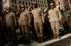 Members of the U.S. Marines salute during the opening ceremonies of the 87th Veterans Day Parade in New York City. (Photo credit: Ramin Talaie/Corbis via Getty Images)