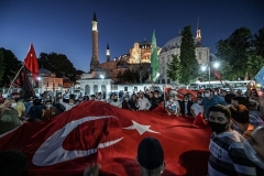 Muslims celebrate outside the Hagia Sophia on Friday after the court decision paved the way for the historic building to be reconverted into a mosque.  (Photo by Ozan Kose/AFP via Getty Images)